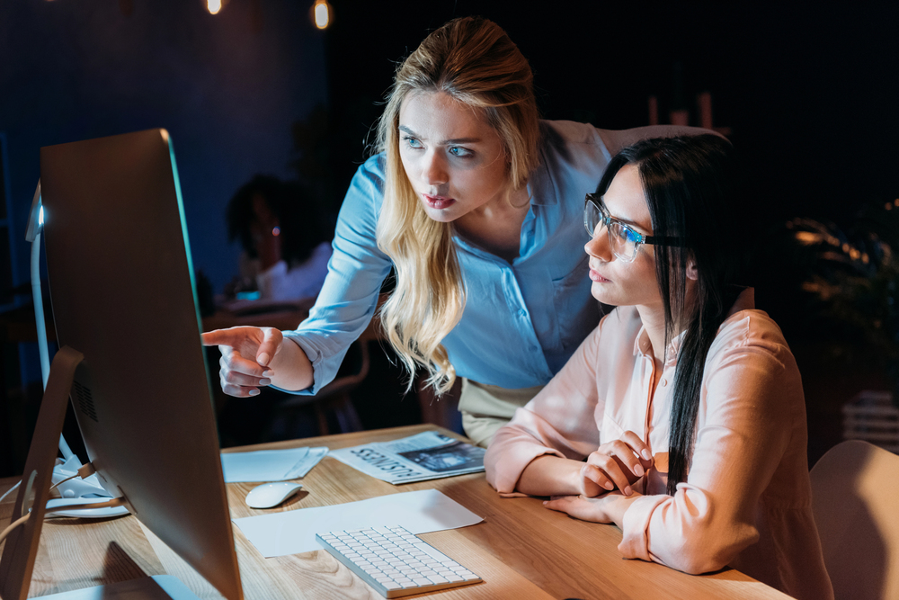 women working together on a website